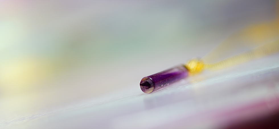 Cylindrical purple crystal